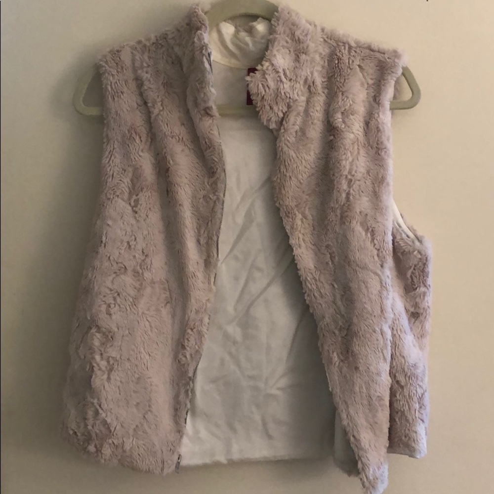 Tan fur vest. Lightly worn but looks new